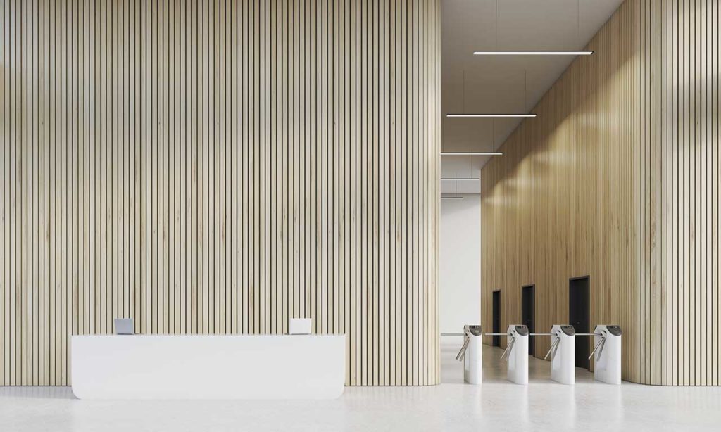 Waist High Turnstiles In A Chic And Modern Office Building Lobby.